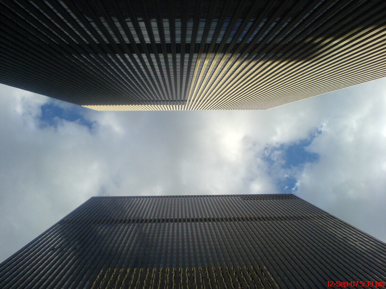 Looking towards the sky with skyscrapers either side, New York City, NY, USA