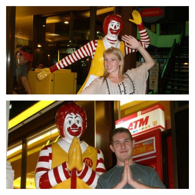 Rosie and Karl stand in front of Ronald McDonald's statues outside McDonald's in Thailand