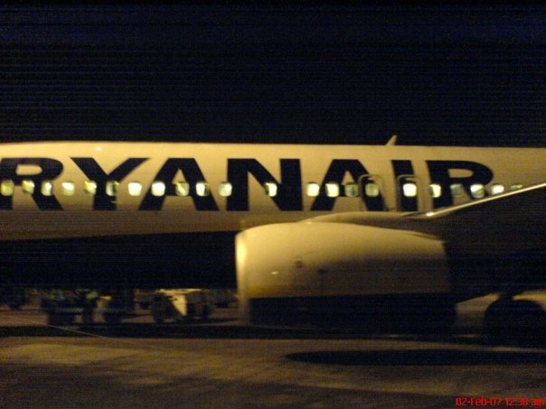 the side of a Ryanair Boeing 737 plane on a stand at Stansted Airport