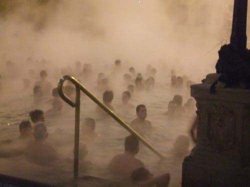 people in a steaming bath of Széchenyi gyógyfürdő Széchenyi Medicinal Bath in Városliget City Park, Budapest