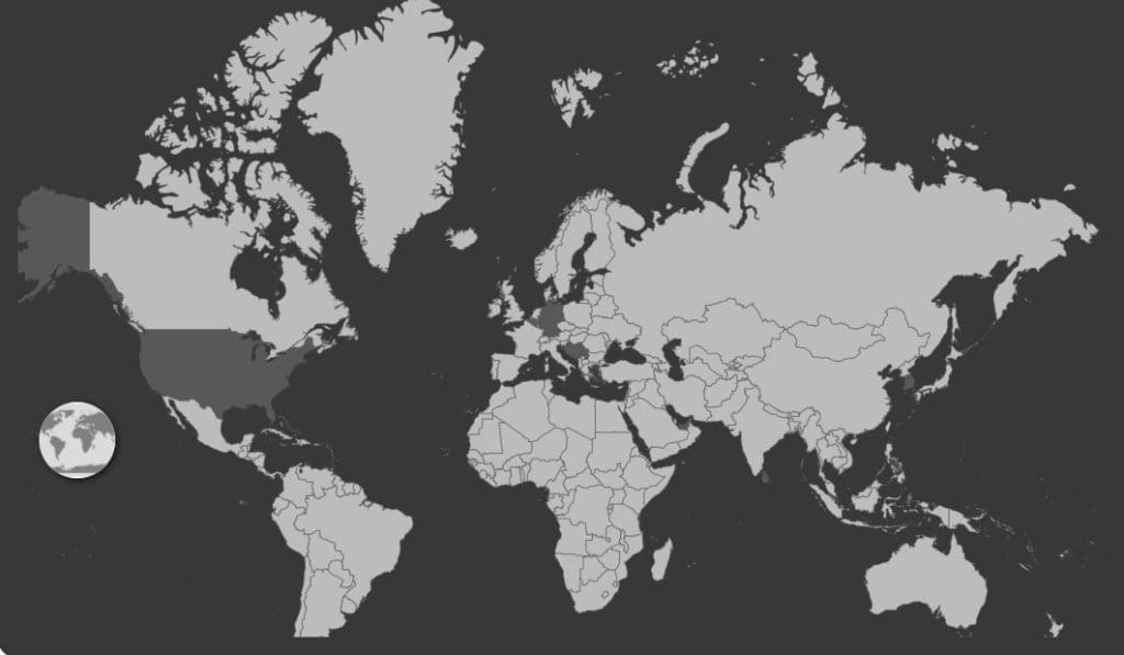 A world map with the land in light grey and the water in dark grey
