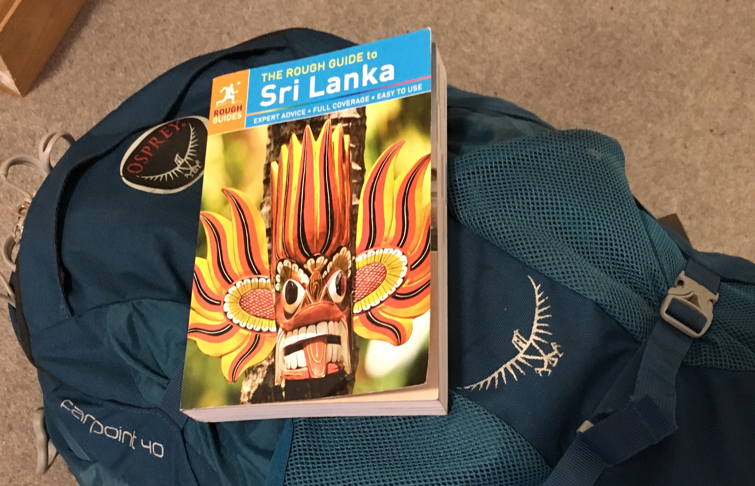 The Rough Guide to Sri Lanka book on top of a blue Osprey Farpoint 40 backpack