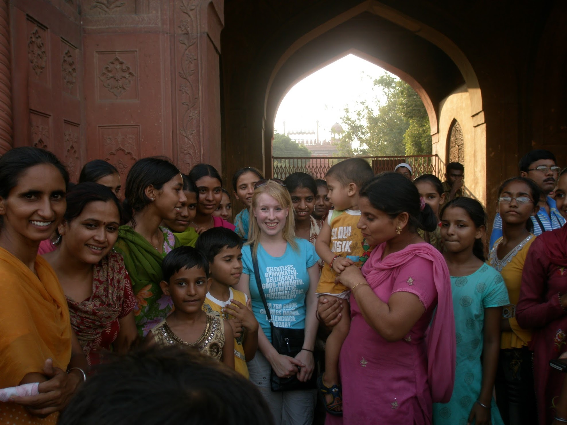 Rosie stands amongst teenage Indian girls at Red Fort Delhi, India