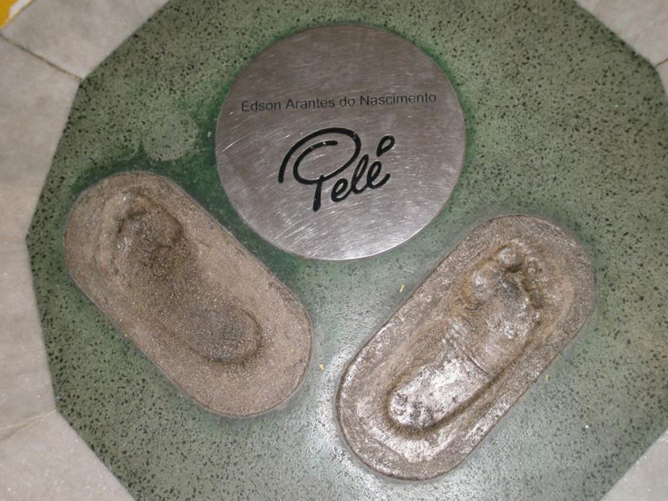 Pele's footprints in concrete with a signed bronze plaque on the walk of fame at the Maracana Stadium, Rio de Janeiro