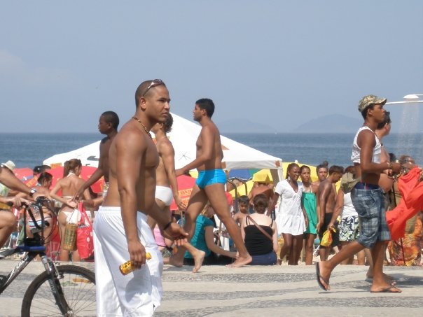 People walk along the promenade at Ipnema beach