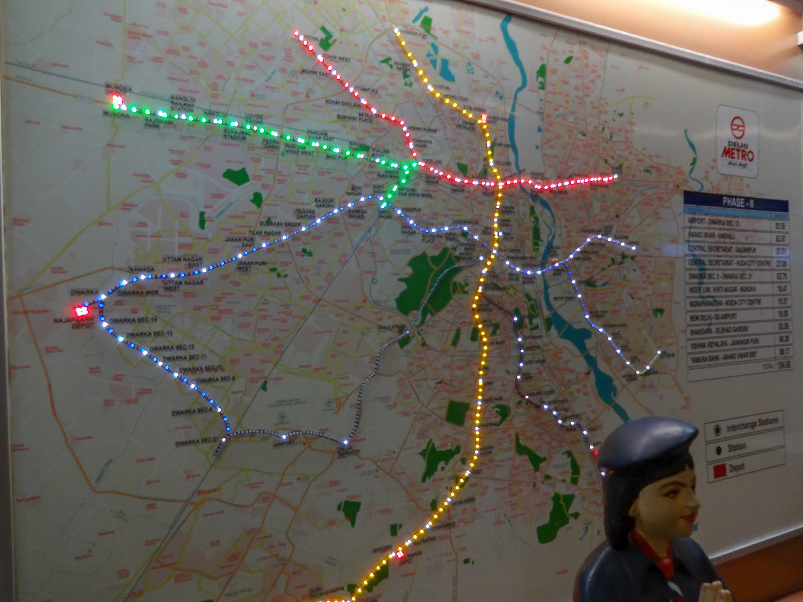 a map of the Delhi metro lit with coloured lights