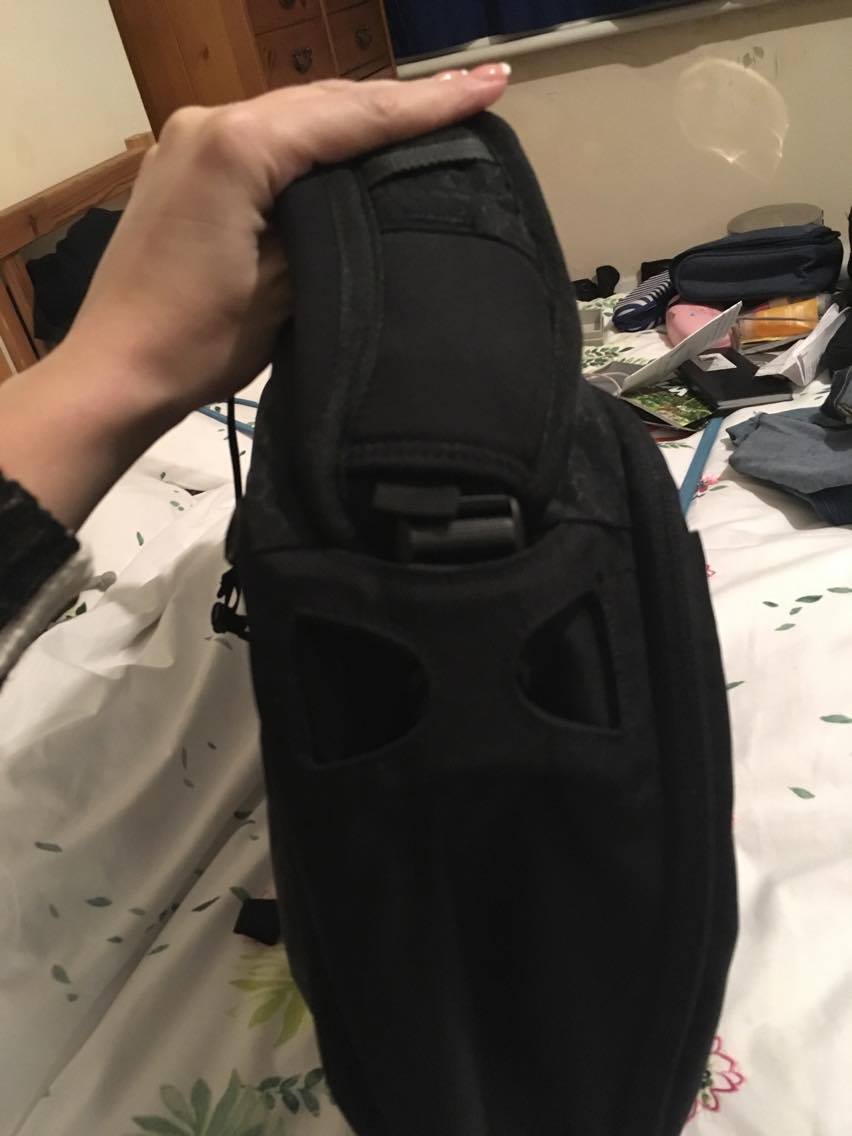 strap and clip on a black Kathmandu Litehaul 38L backpack