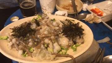 a gif of a plate of San-Nakji octopus minor tentacles writhing, Seoul, South Korea