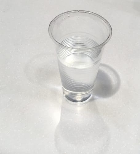 a clear plastic cup of water