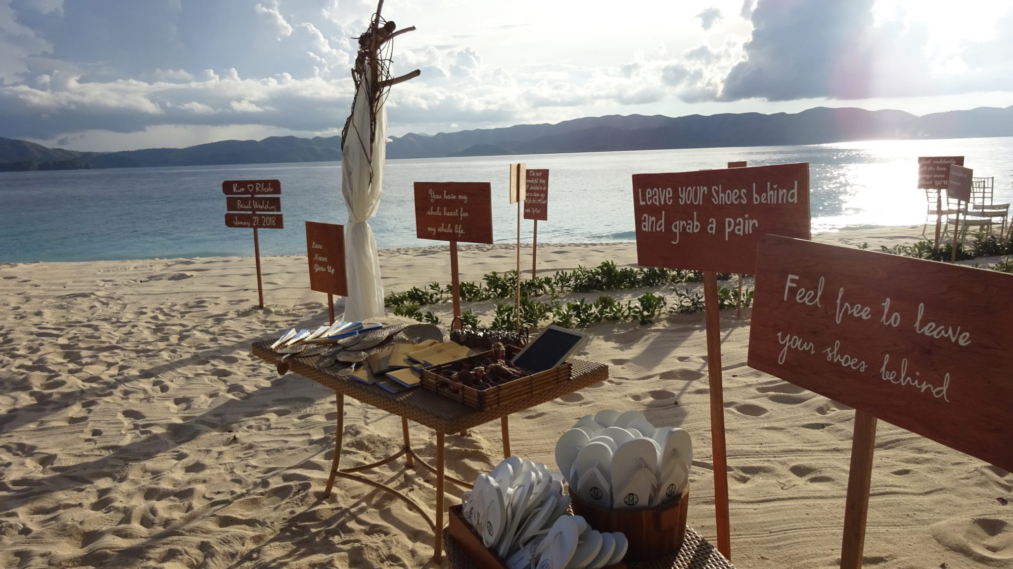 favours table for a wedding on the white sandy beach with the South China Sea in the background at Club Paradise Palawan