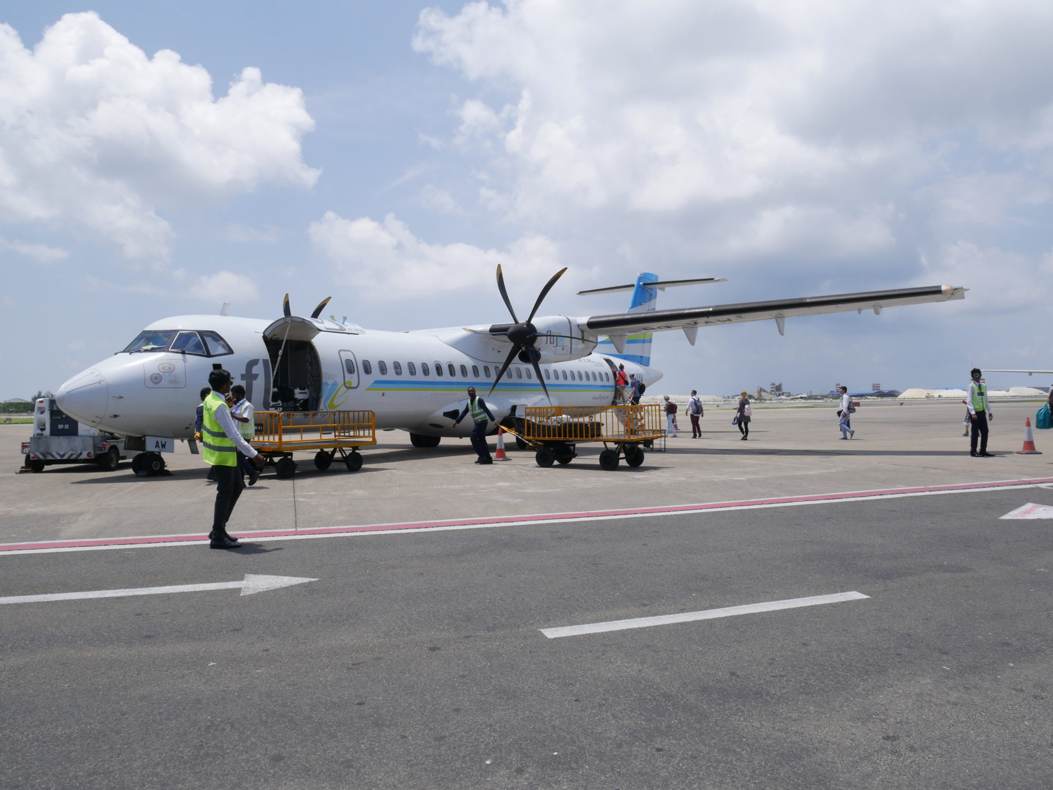 Flyme ATR 72-500 on the tarmac as passengers board the rear door