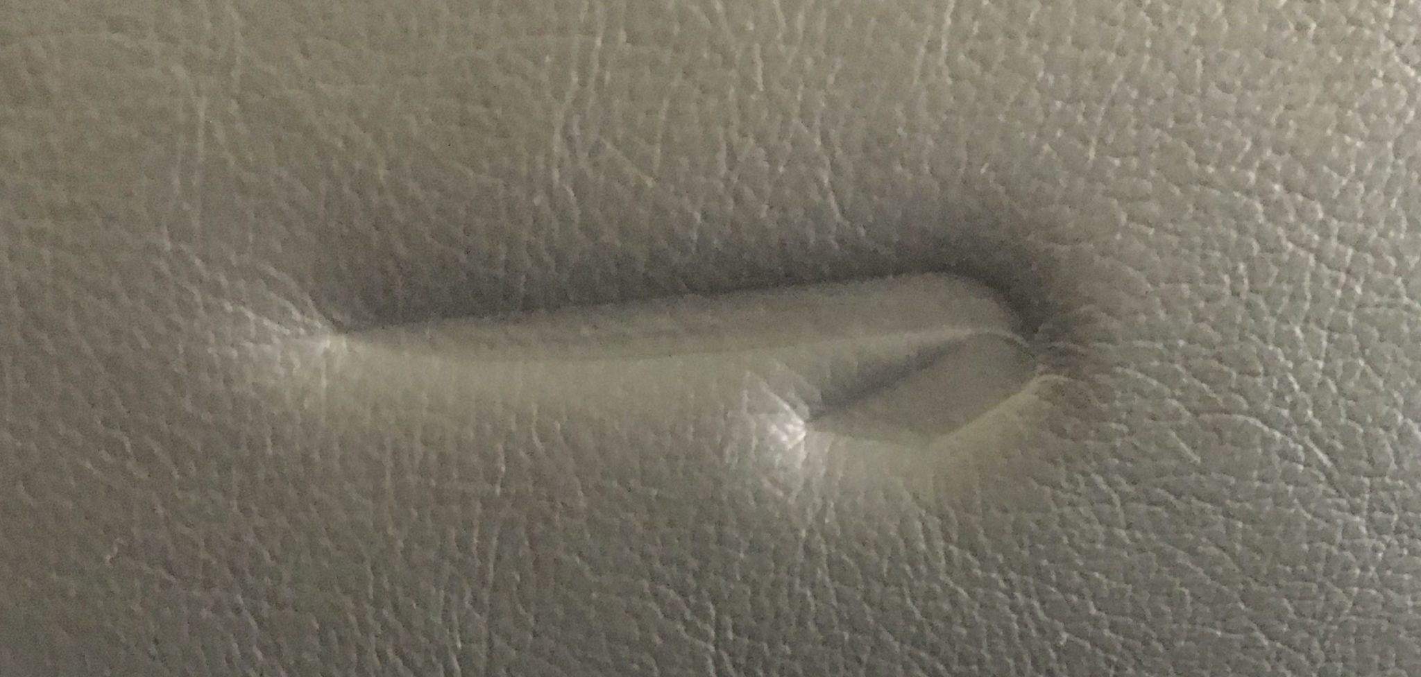 British Airways logo in a leather aeroplane seat