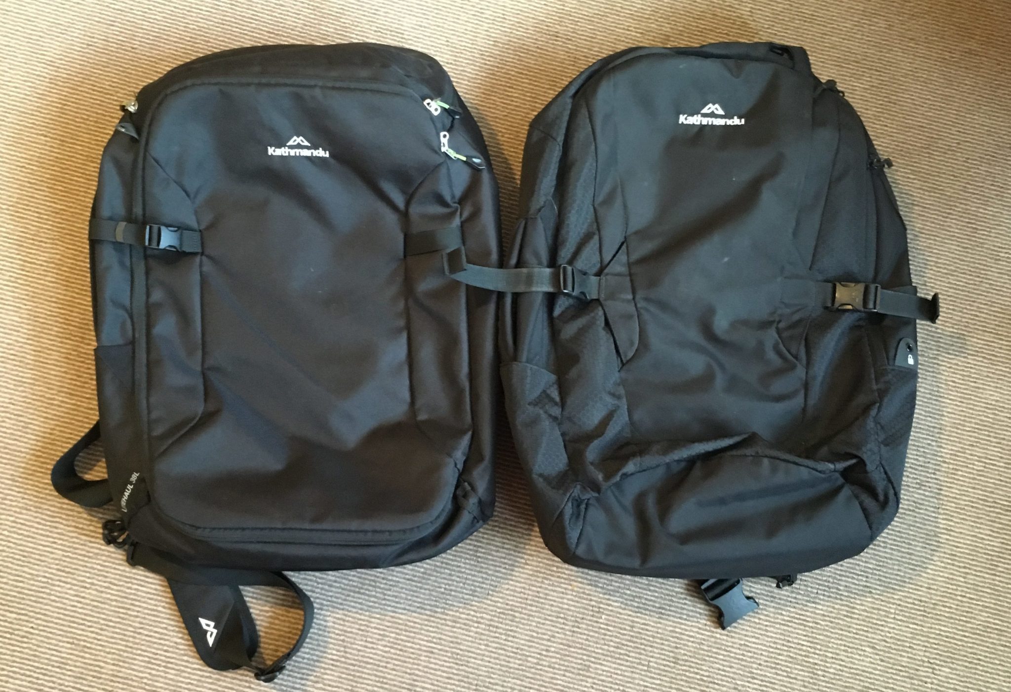 2 black backpacks Kathmandu Litehaul 38L (2018) on the left and Kathmandu Litehaul 38L V3 (2017) on the right