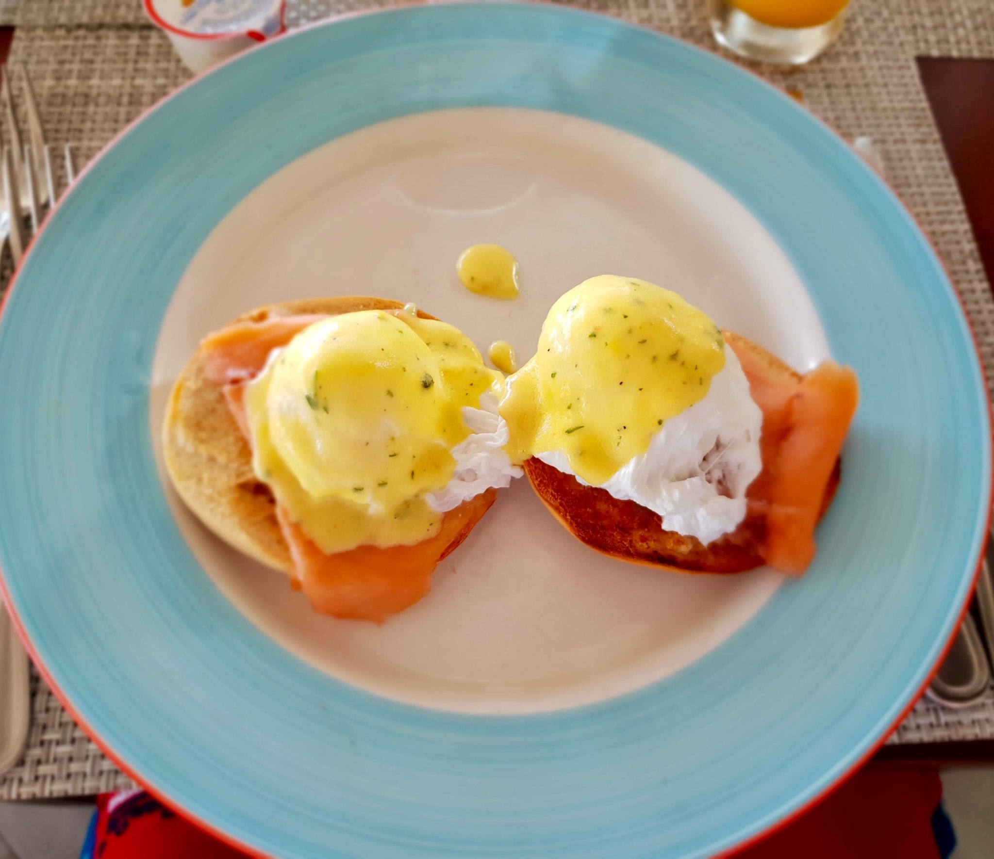 eggs royale on a blue rimmed plate