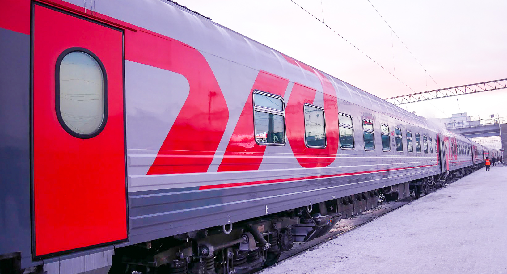 a trans-Siberian train on a platform in Russia