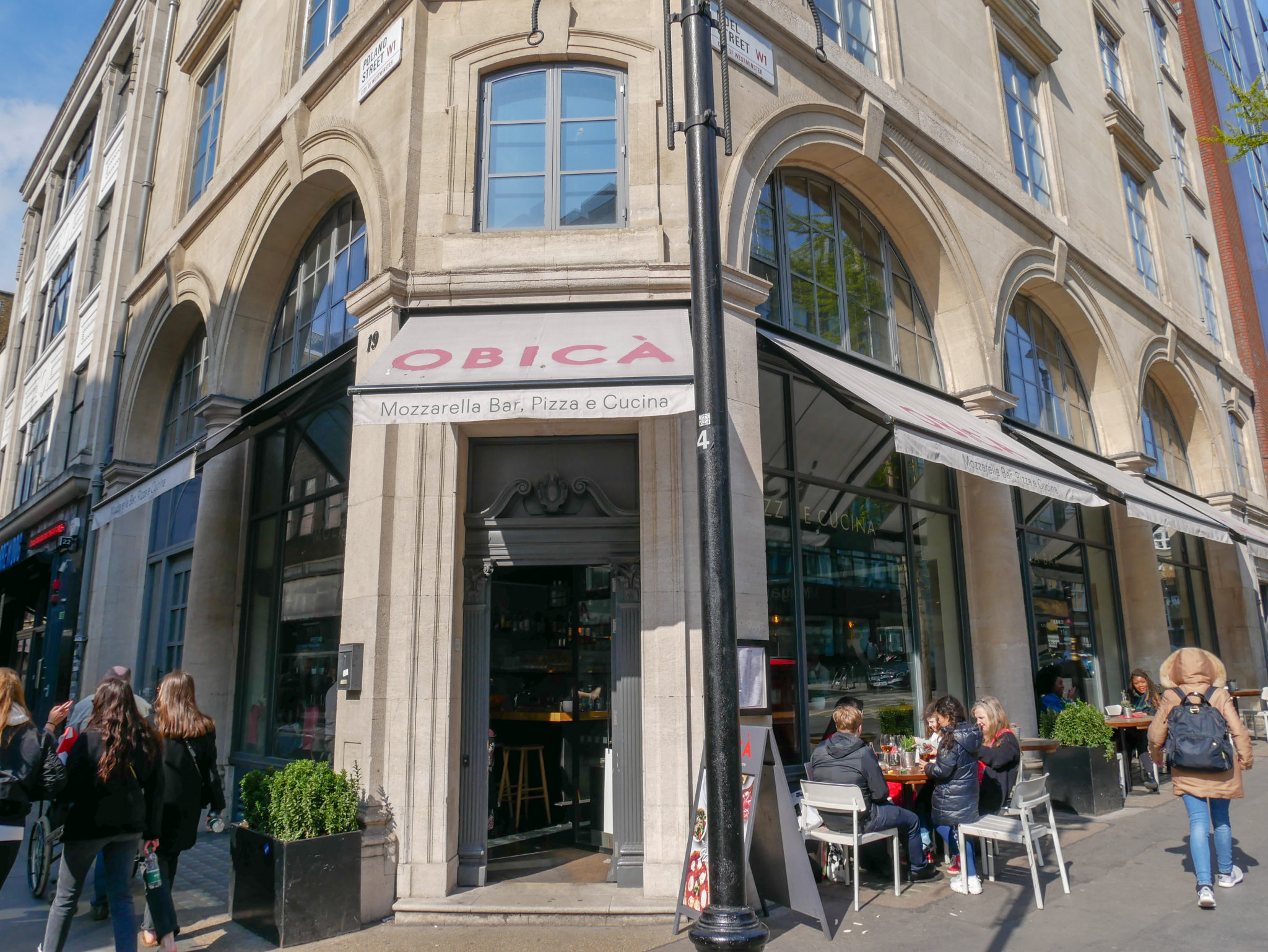 The outside of Obicà Mozzarella Bar on the corner of Poland Street & Noel Street, Soho, London
