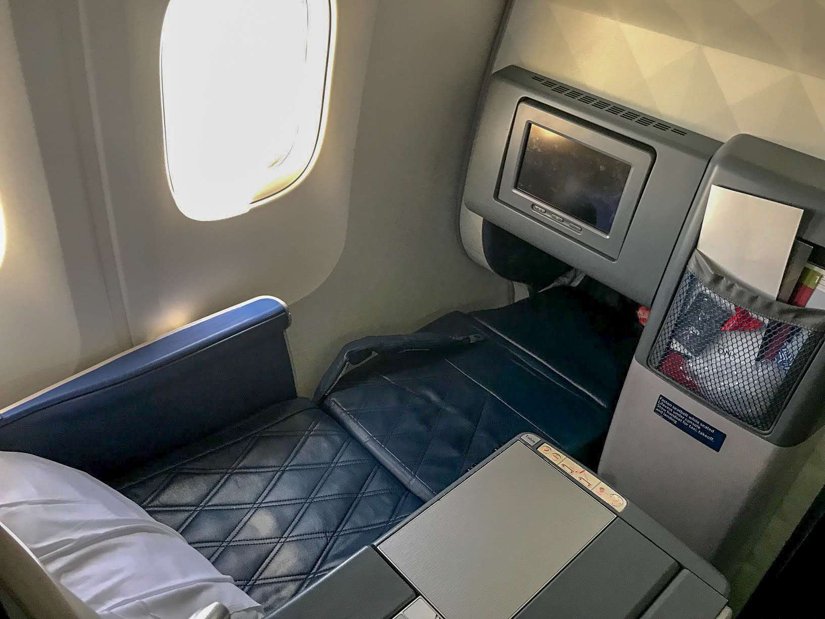 Delta One seat reclined on a Delta Air Lines Boeing 767