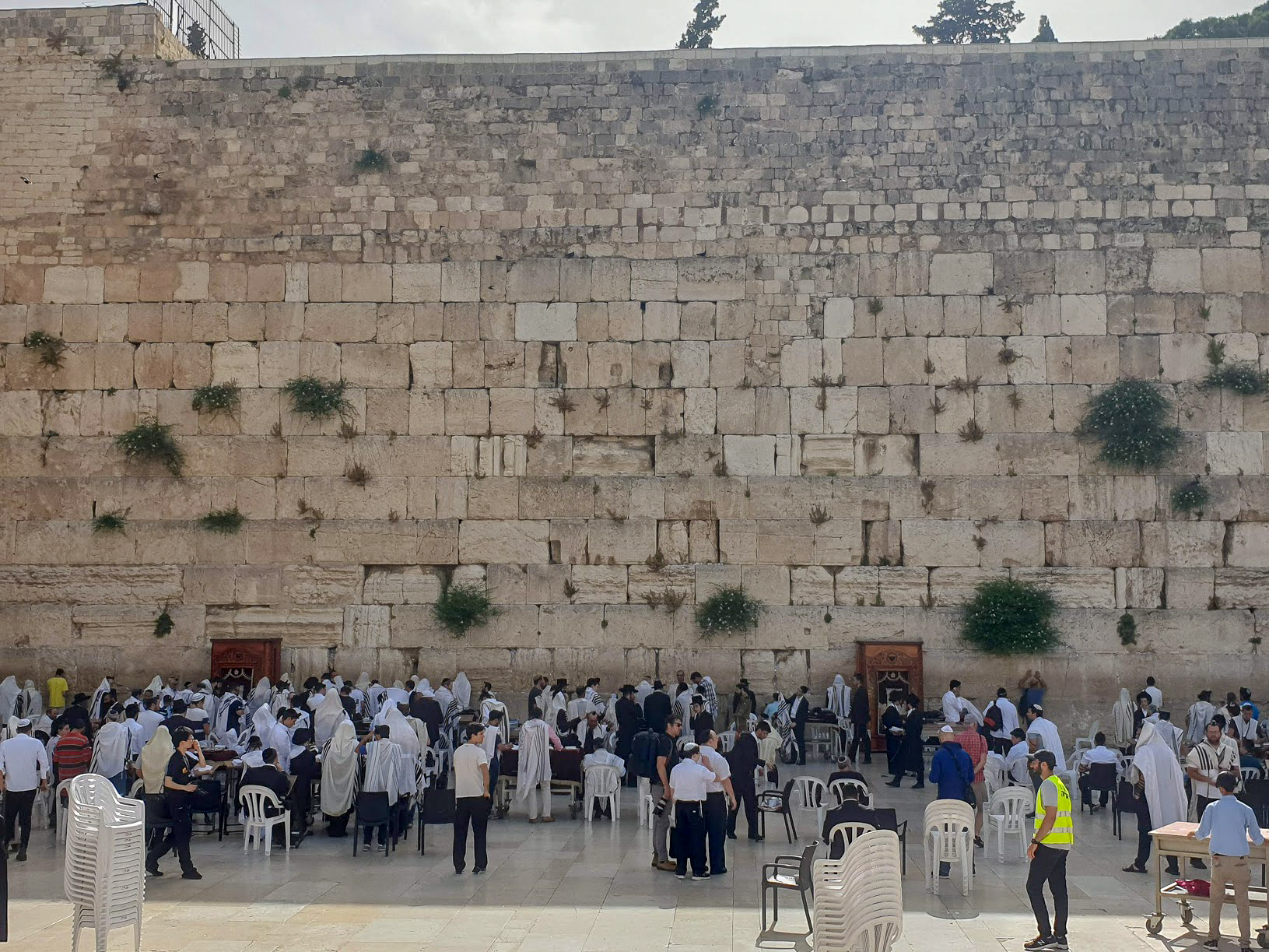 the Western Wall, Jerusalem with men praying
