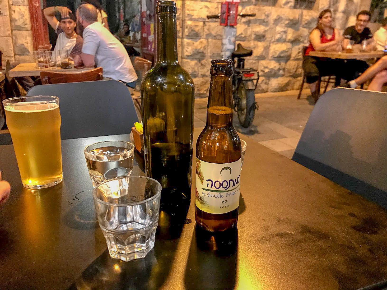 drinks on an outside table at The Sira pub, Jerusalem