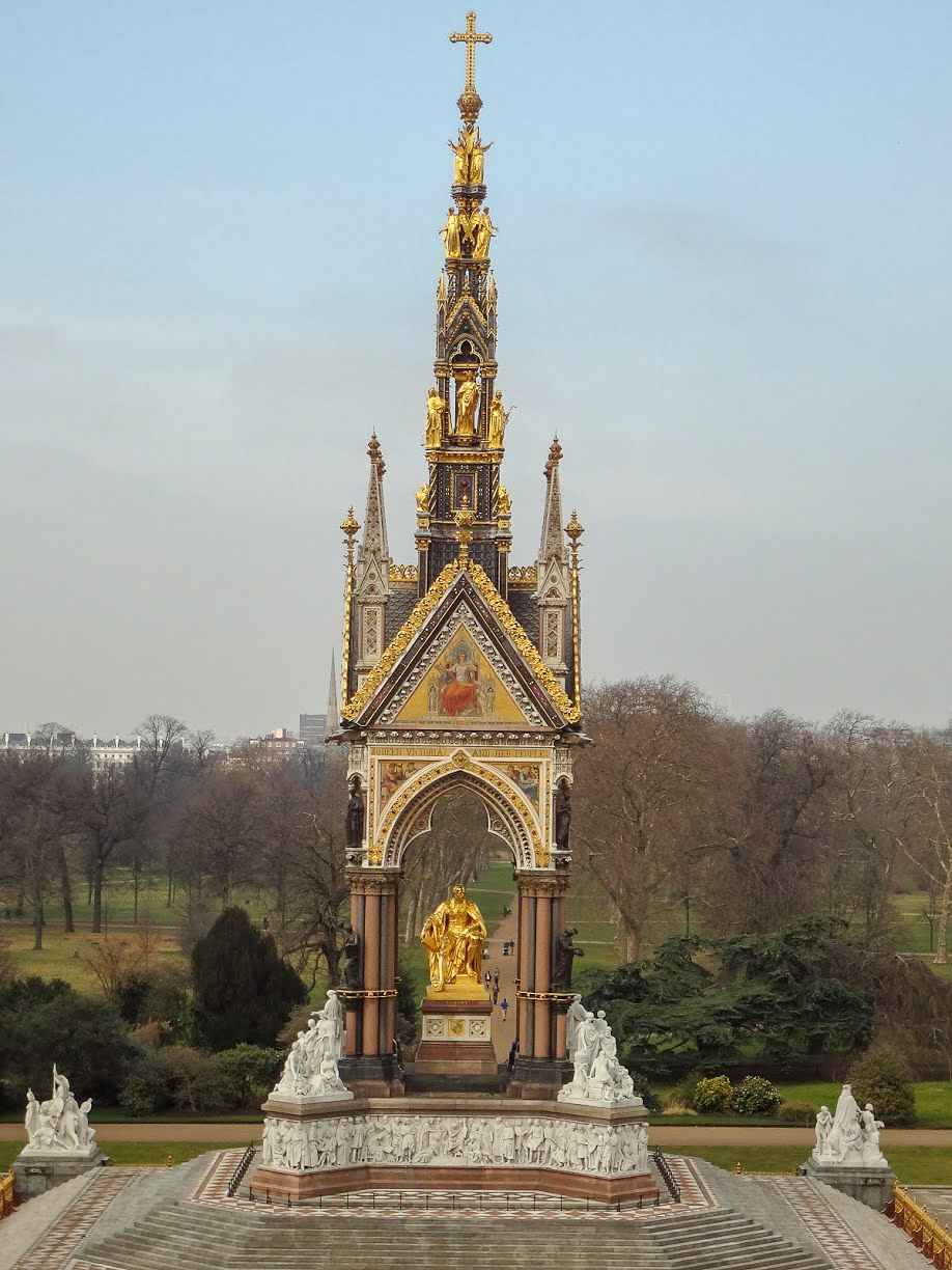 a gold statue of Prince Albert sits inside the opulent Albert Memorial in Kensington Gardens, London