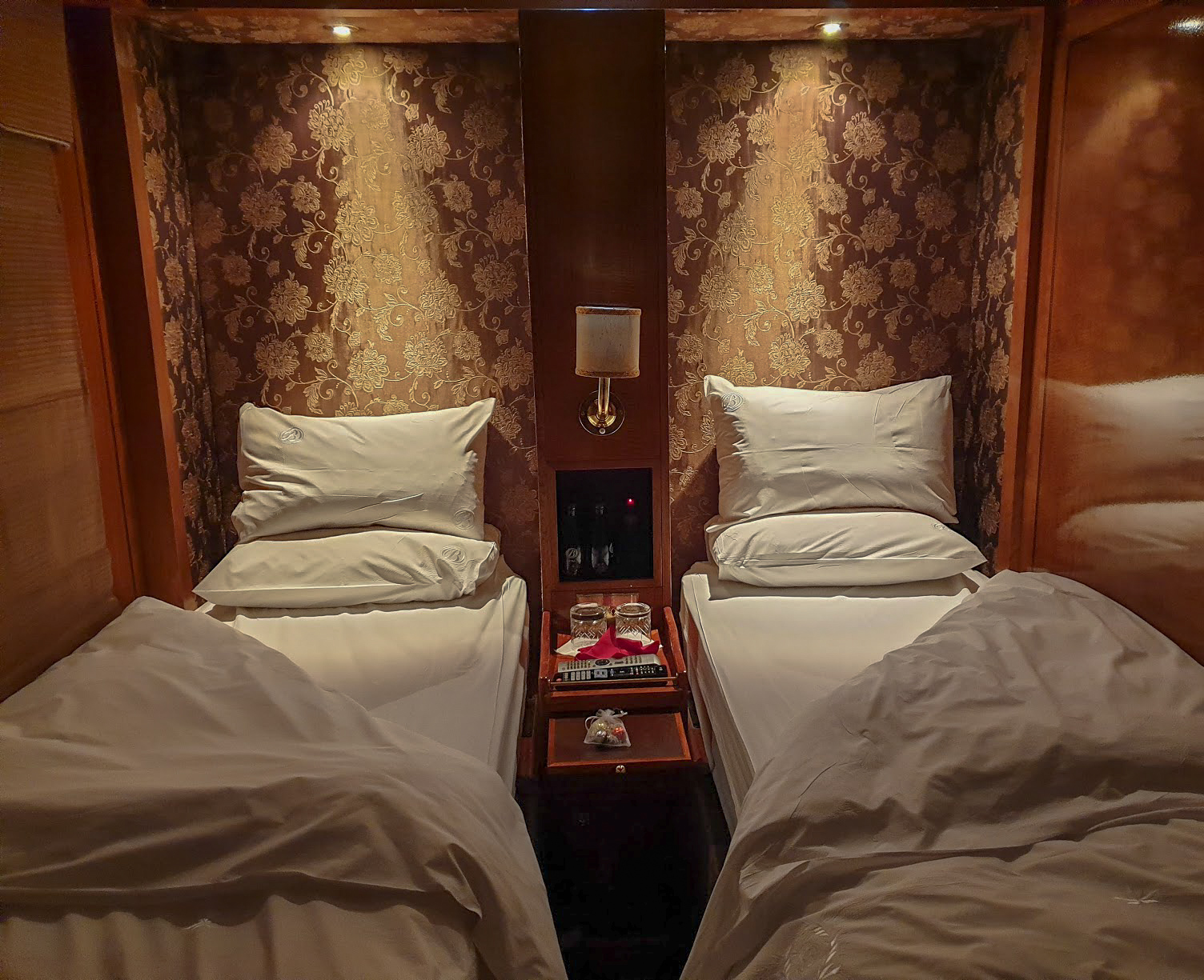 The single beds turned down at night in the De Luxe Suite on The Blue Train