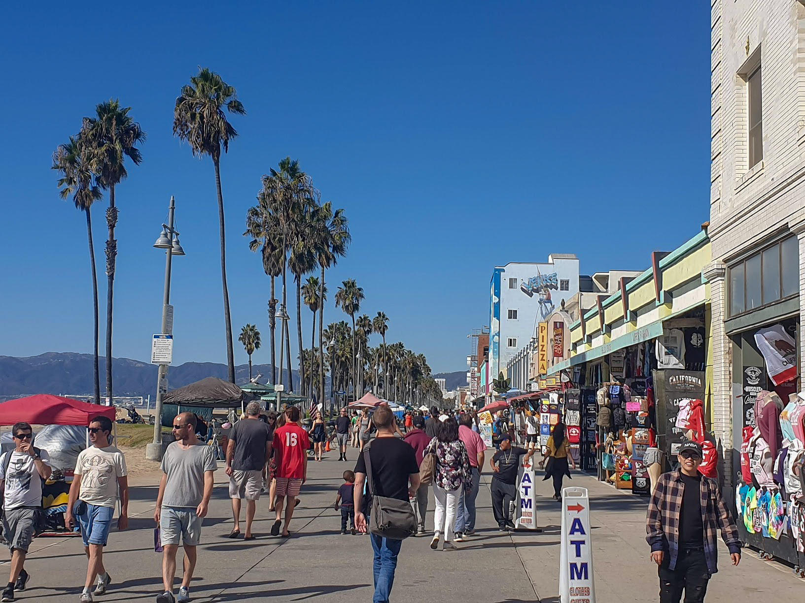 People walking along Venice Beach promenade, Los Angeles