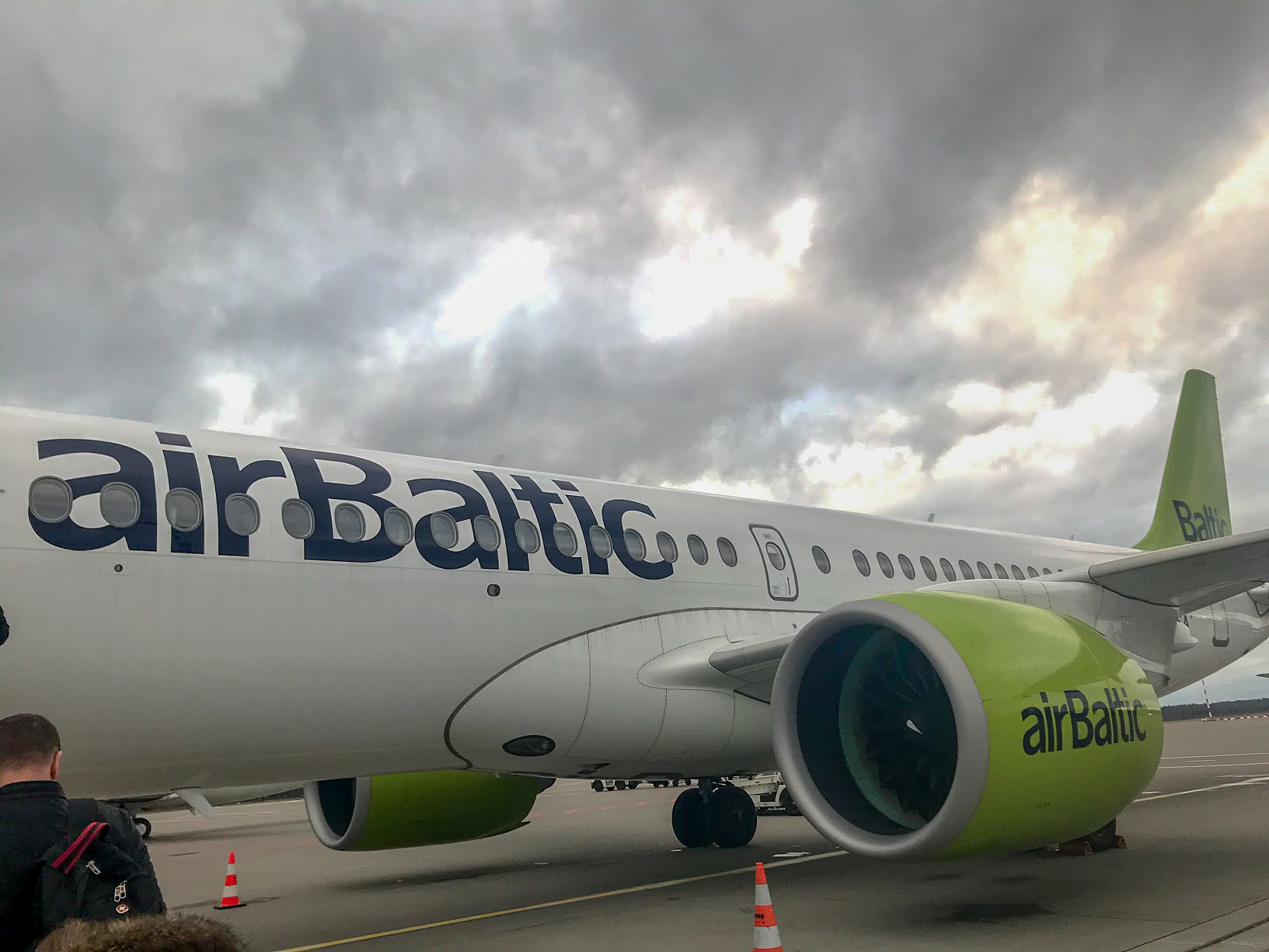 airBaltic Airbus A220-300 plane on stand
