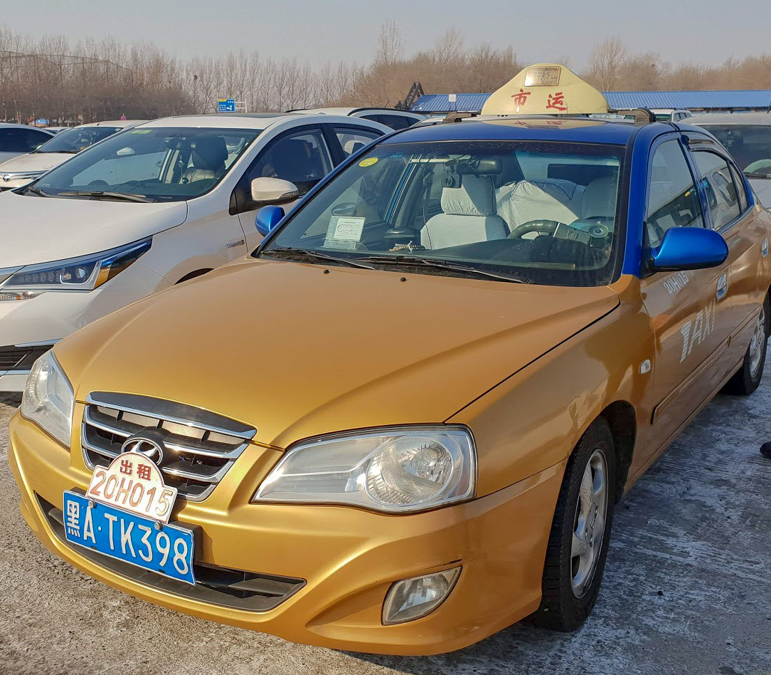 A gold Hyundai taxi in Harbin, China