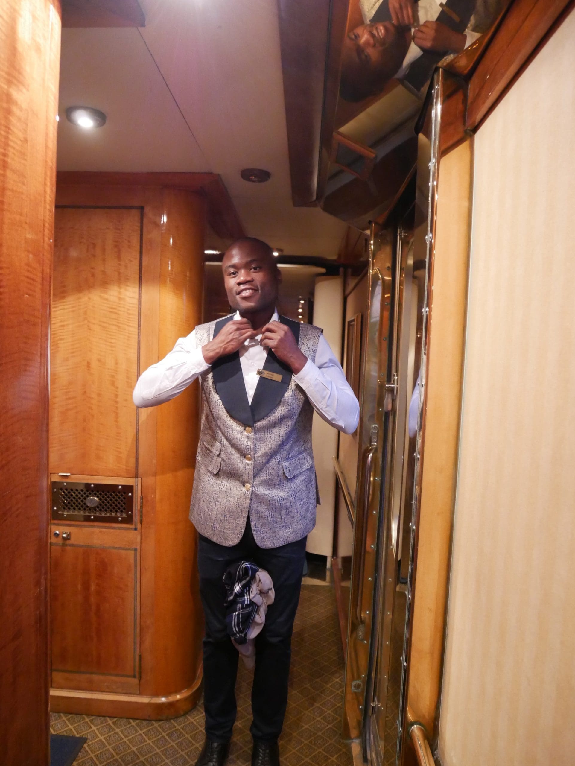 A butler in the corridor on The Blue Train