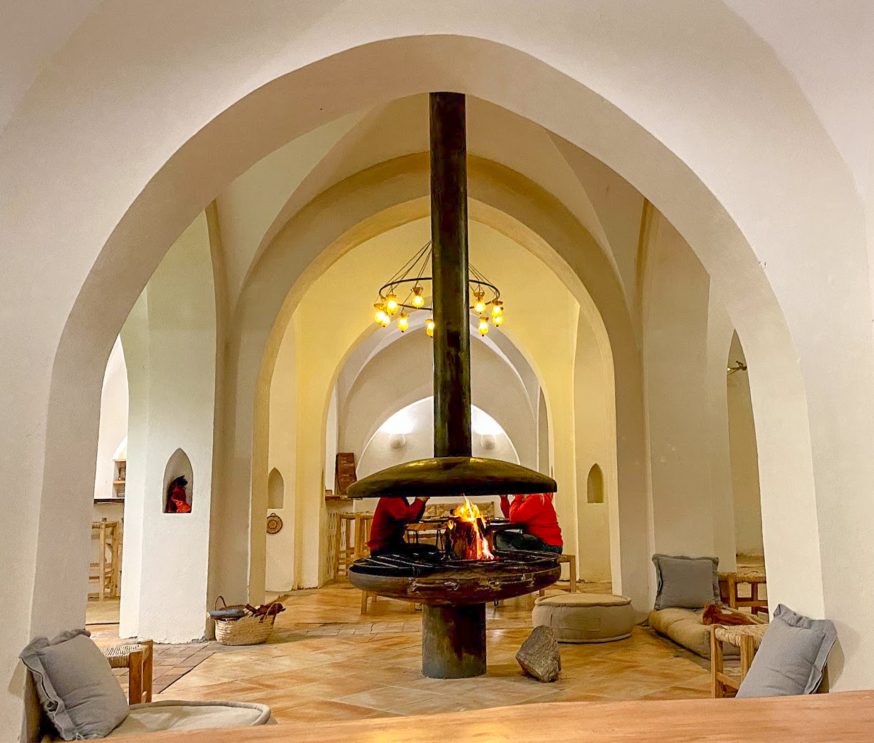 a circular open fireplace in the dining room at Aqua Sun, Gulf of Aqaba, Egypt