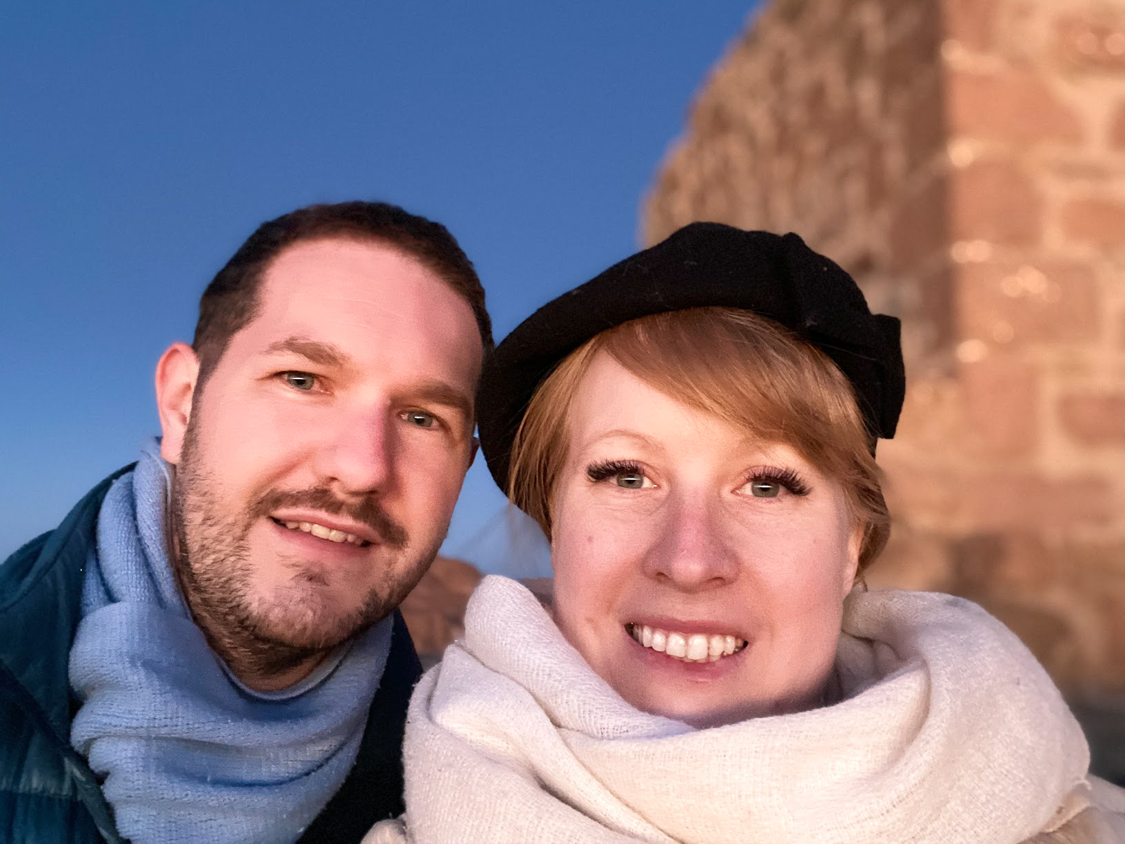 A selfie of Karl and Rosie both wearing scarves in the early morning sun on Mount Sinai, Egypt