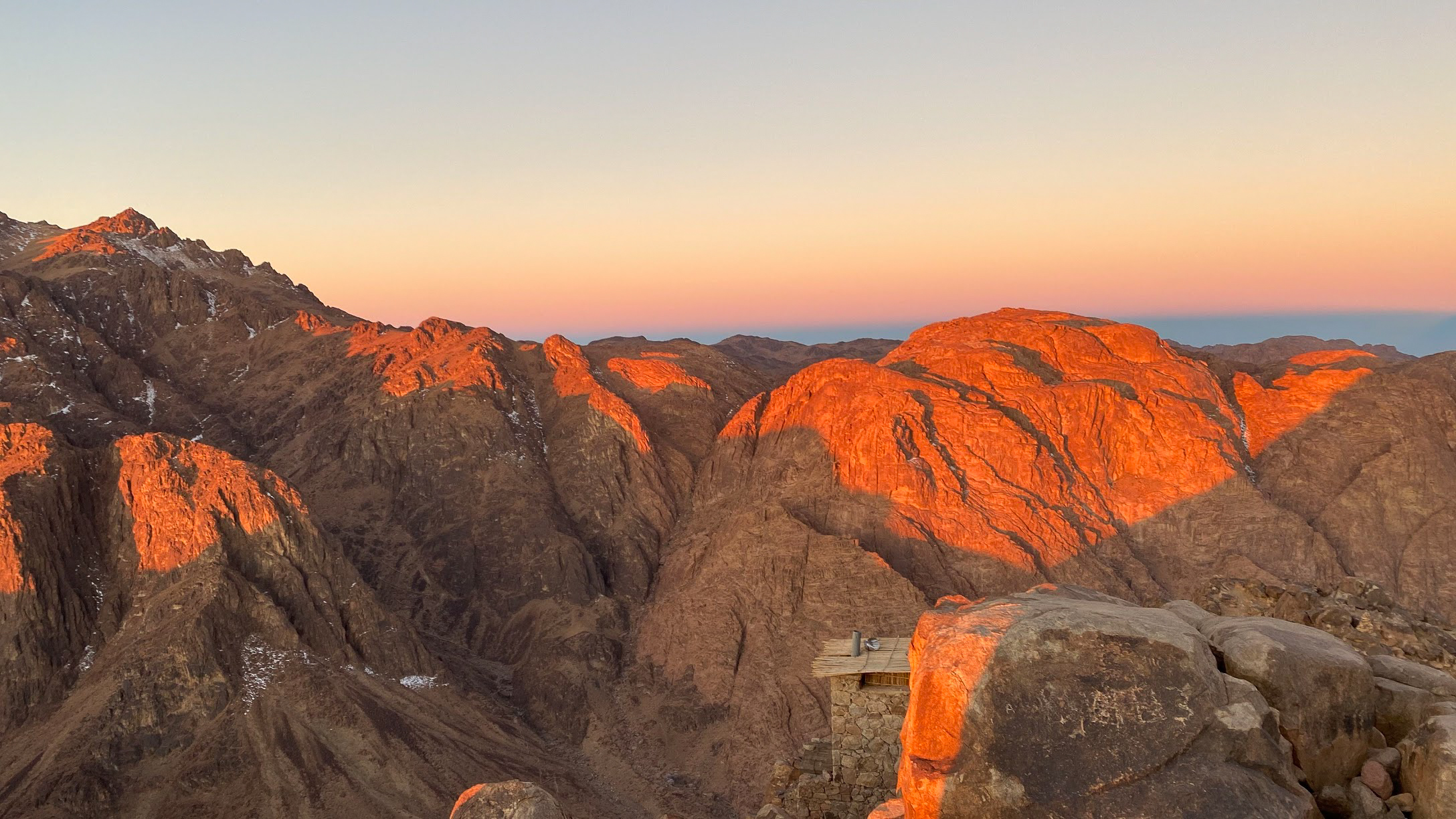 The orange sunrise and the shadows cast over the mountains of Mount Sinai, Egypt