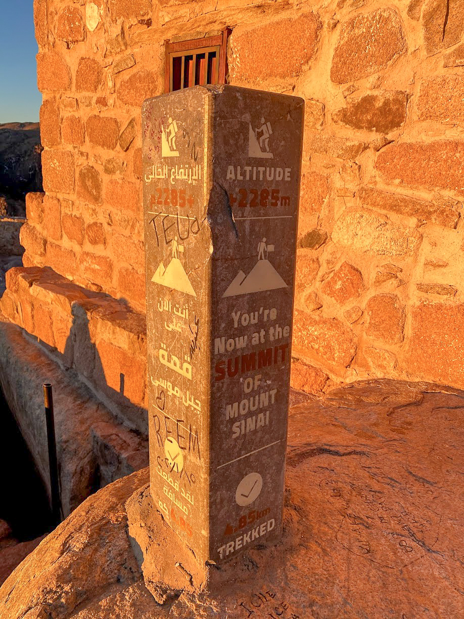 A way marker in the morning sun showing the summit of Mount Sinai, Egypt at 2285m, 4.85km trekked