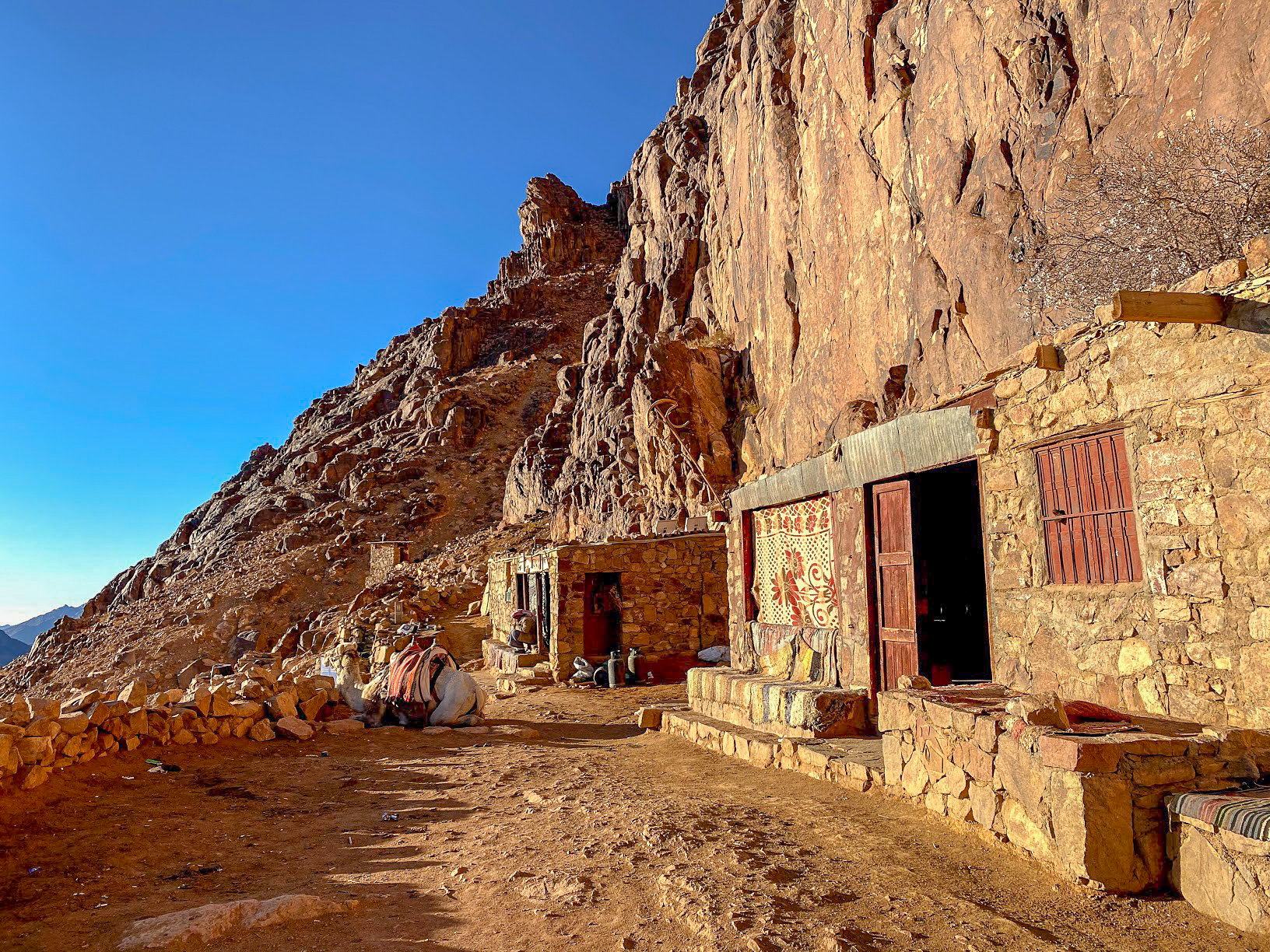 a stone shop in the side of Mount Sinai, Egypt against a clear blue sky