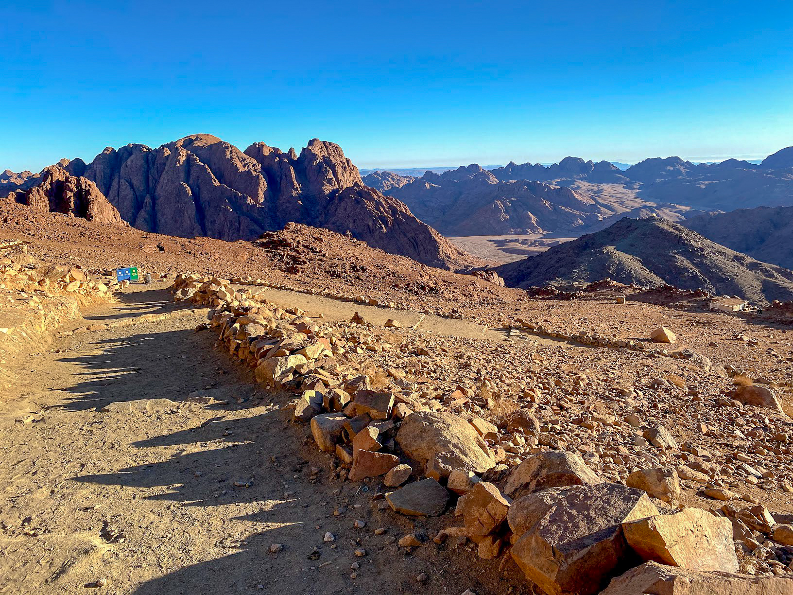 the rocky path down from the summit of Mount Sinai, Egypt with clear blue sky in the background