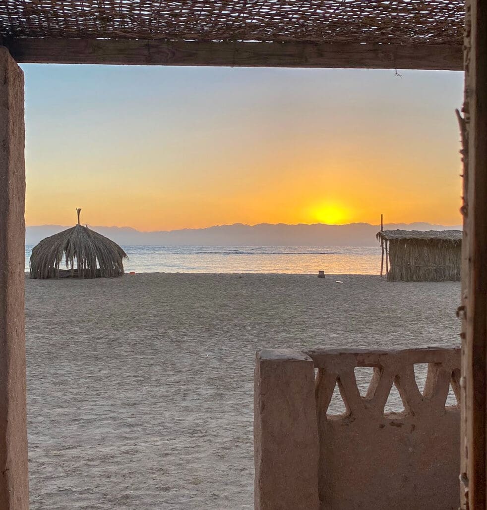 Sunrise view from a Husha hut on the beach at Aqua Sun, Gulf of Aqaba, Egypt
