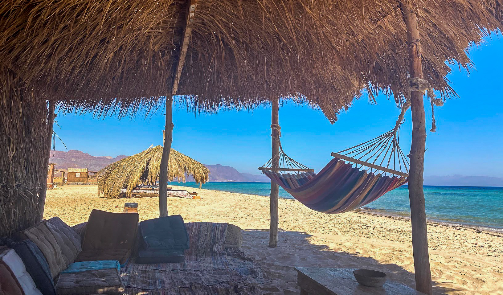 a hammock in a palm hut on the beach at Aqua Sun Beach Camp, Sinai, Egpyt