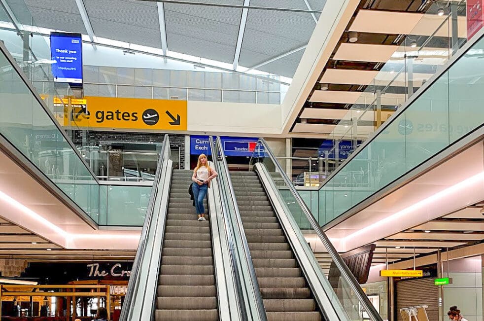 Rosie coming down an escalator at London Heathrow Terminal 5