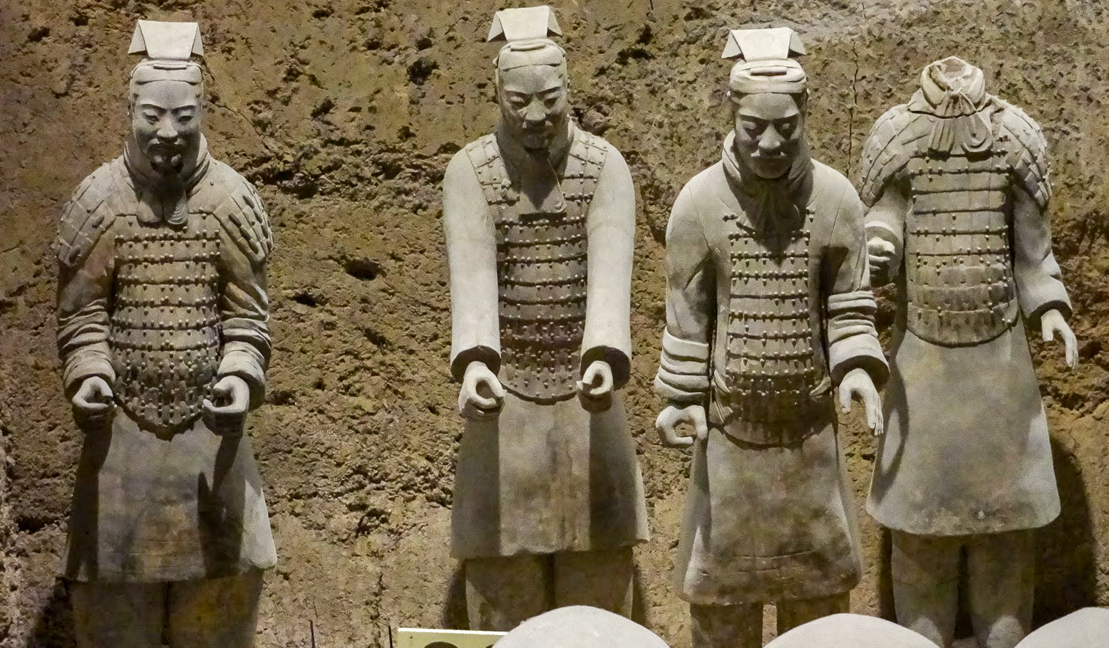 A close up of 4 Terracotta Warriors of the Terracotta Army in Pit 3 at Emperor Qinshihuang's Mausoleum, Xian, China