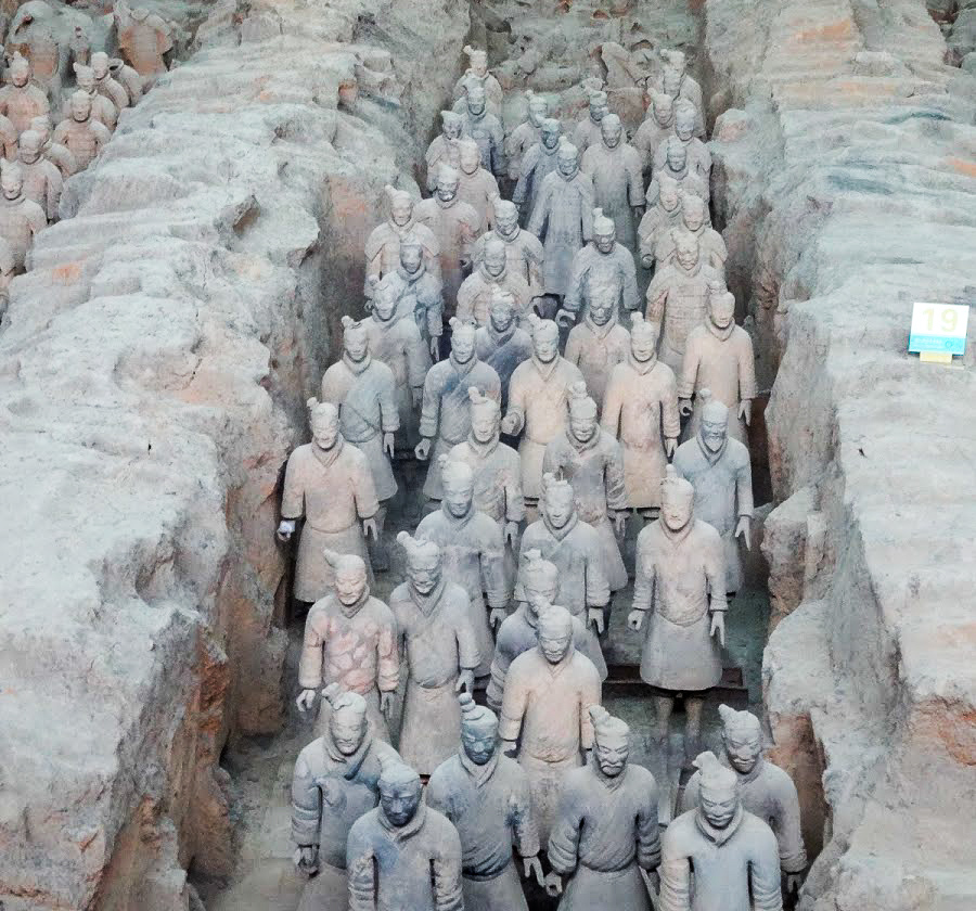 a view along a pit of many Terracotta Warriors of the Terracotta Army, Xian, China