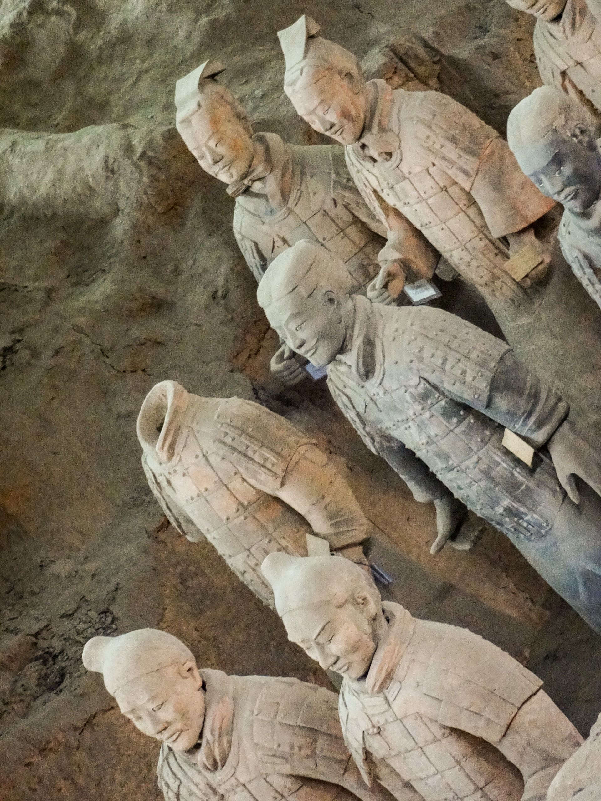 closeup of 6 Terracotta Warriors of the Terracotta Army in a pit in Xian, China
