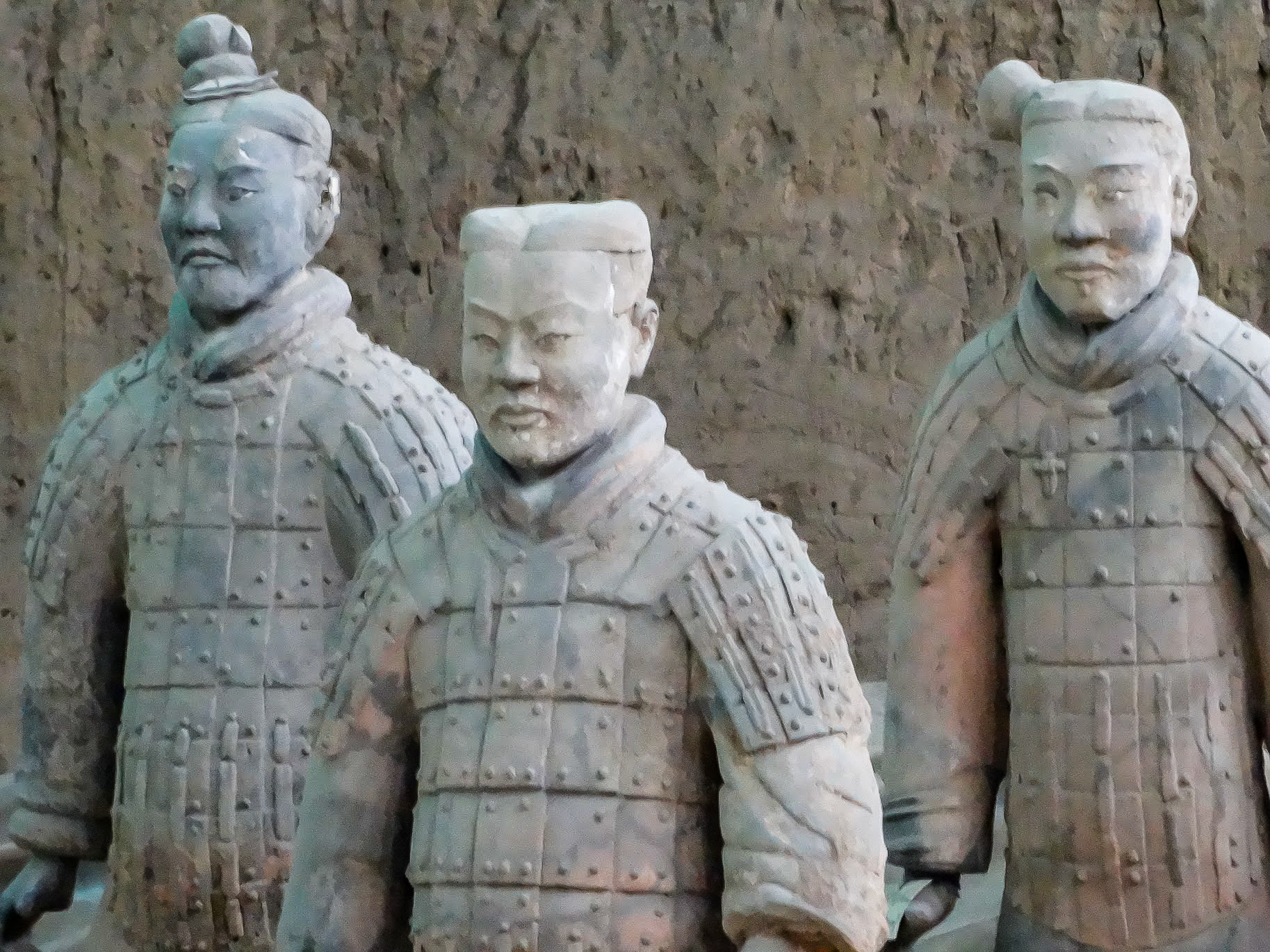 A close up of 3 Terracotta Warriors of the Terracotta Army at Emperor Qinshihuang's Mausoleum, Xian, China