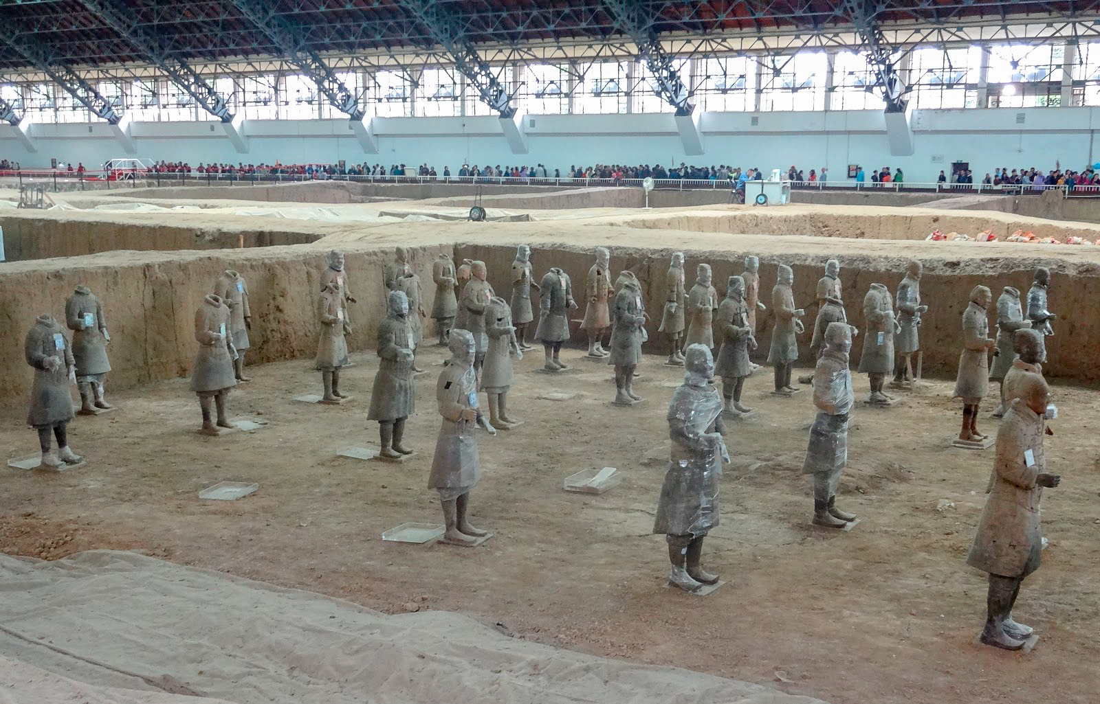 A long view of the side of the Terracotta Warriors of the Terracotta Army inside Pit 1 at Emperor Qinshihuang's Mausoleum, Xian, China