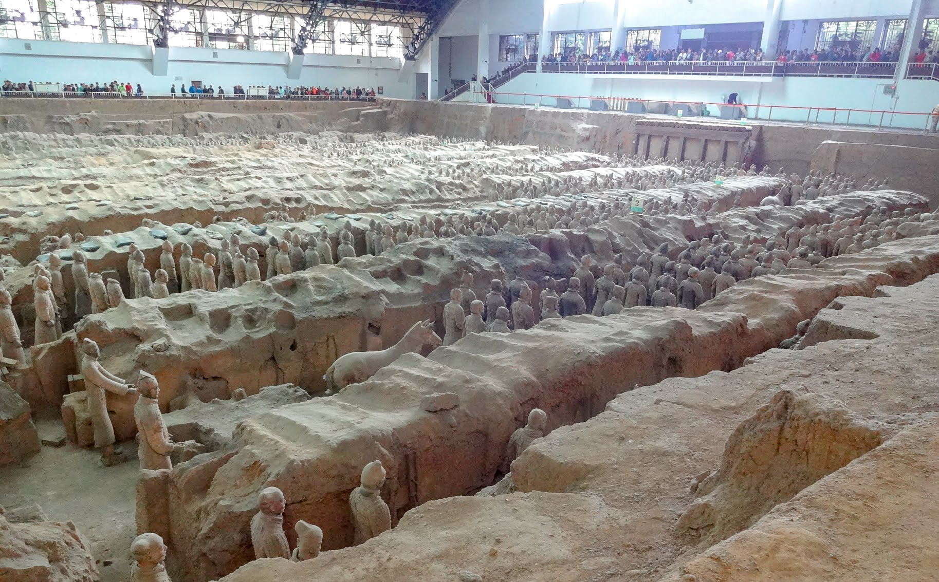 A long view of the back of the Terracotta Warriors of the Terracotta Army inside Pit 1 at Emperor Qinshihuang's Mausoleum, Xian, China