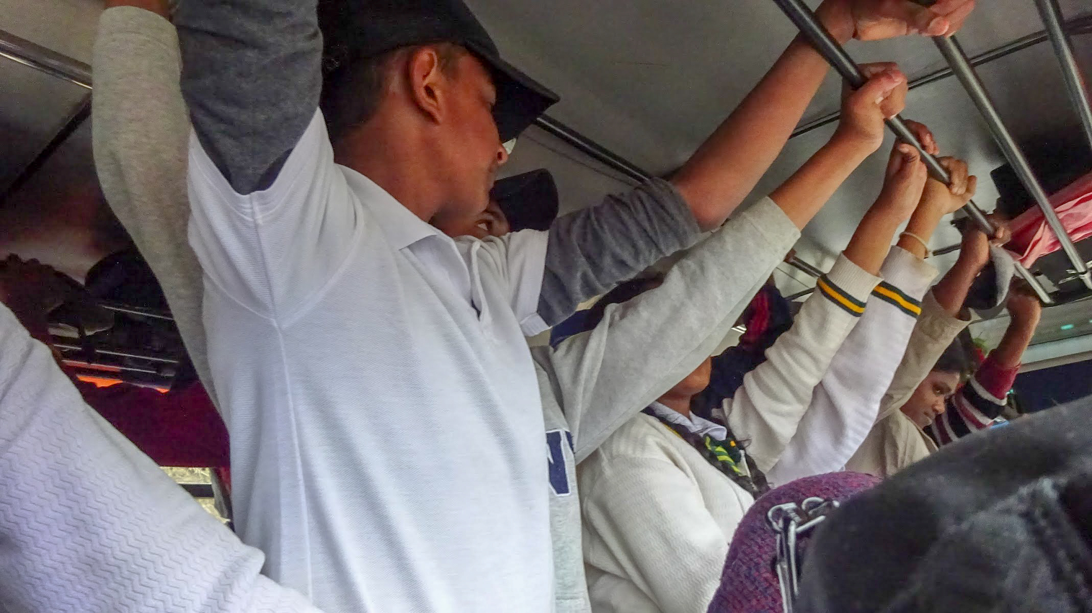 passengers standing on a busy bus in Sri Lanka