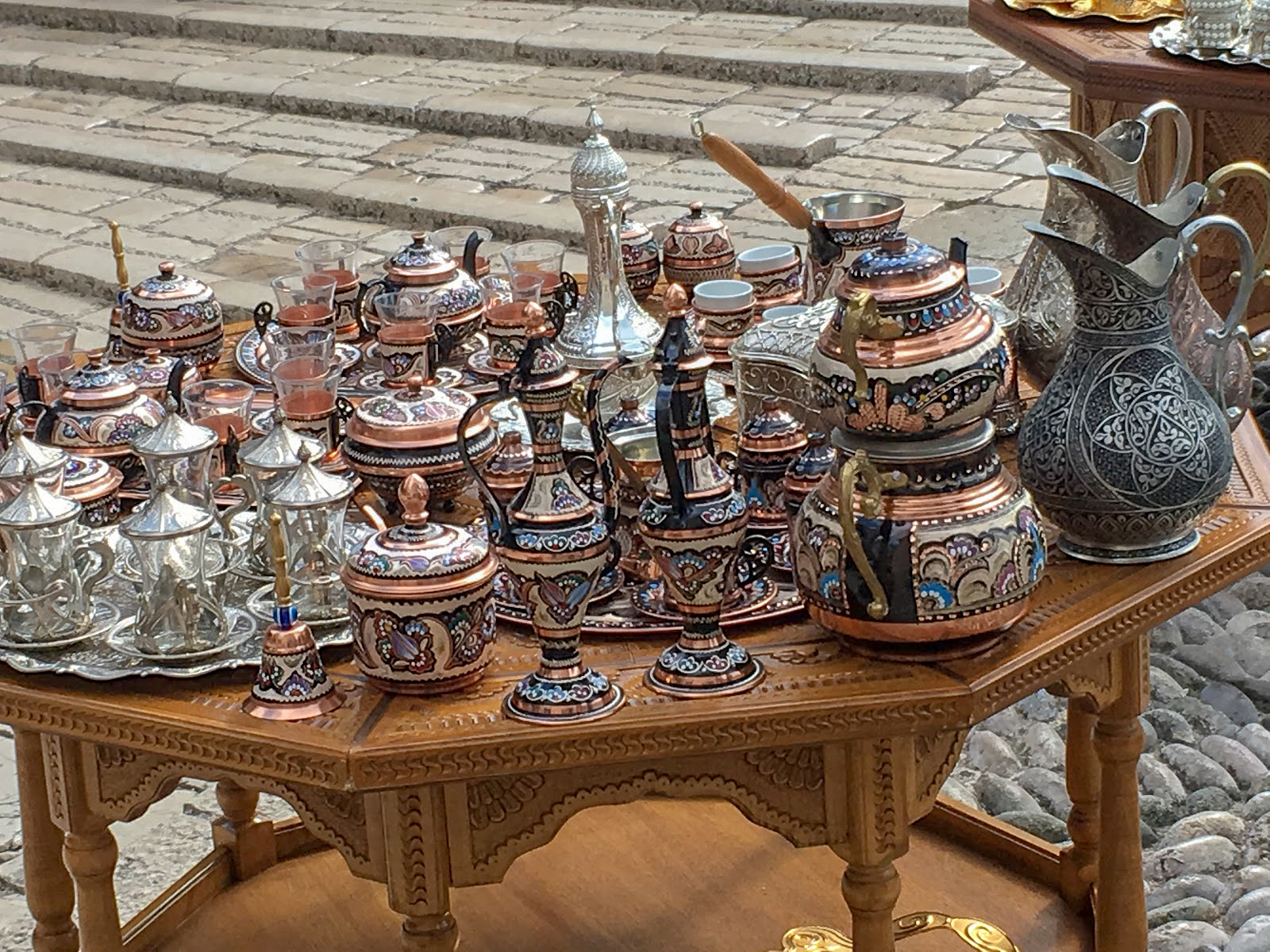 Decorative tea and coffee sets on a wooden table