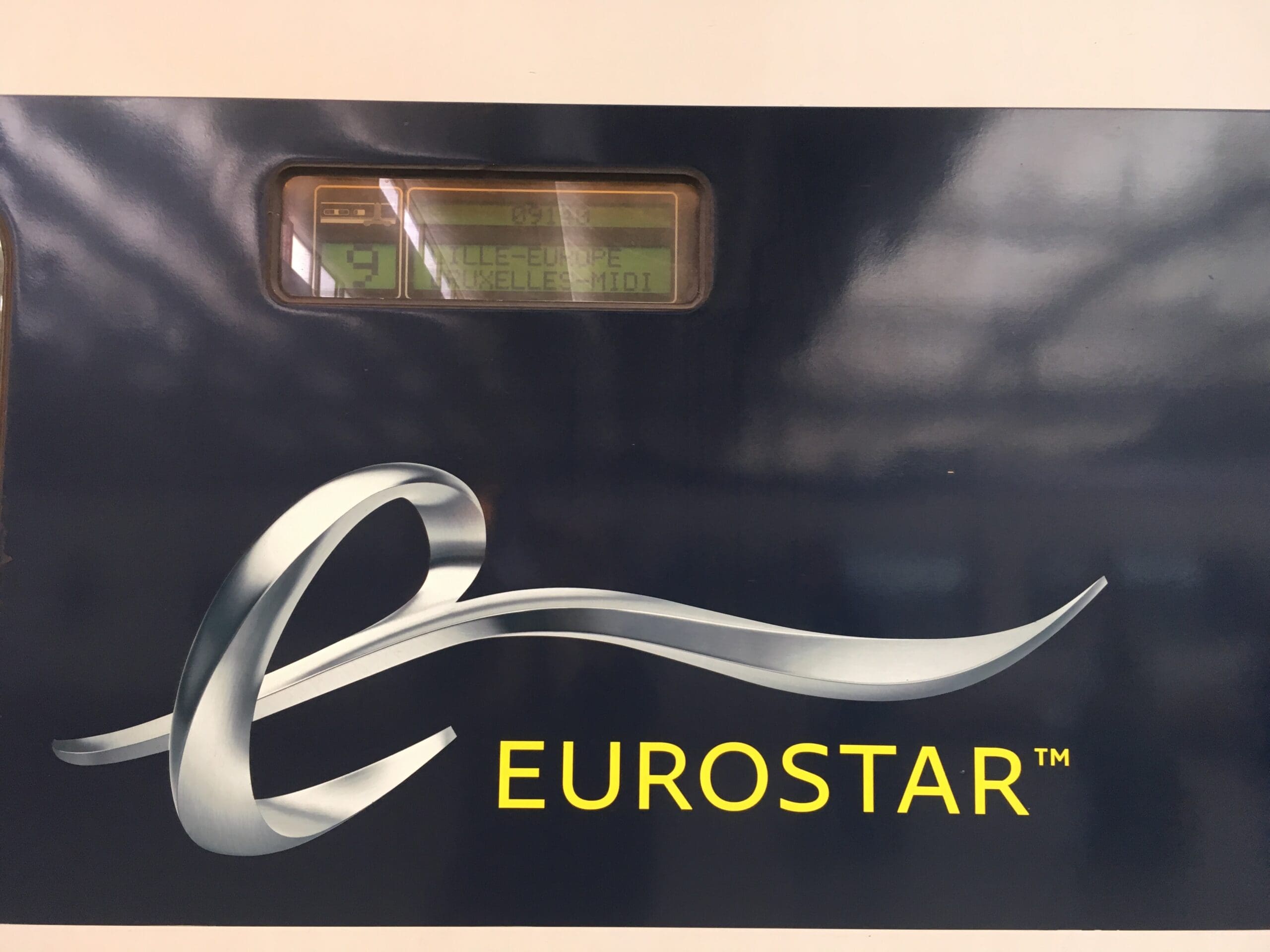 Eurostar Logo on the side of a dark blue train carriage